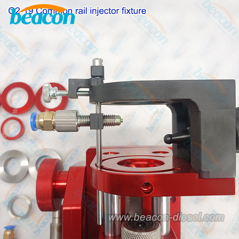 G2-19 common rail injector clamping fixture mounted on a test bench.