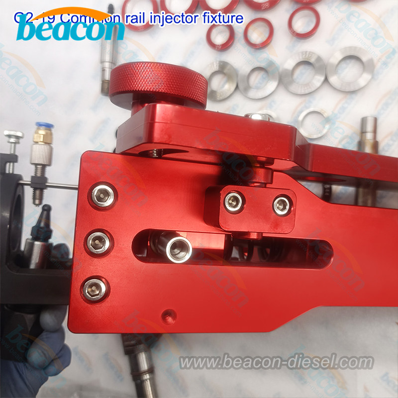 G2-19 common rail injector clamping fixture mounted on a test bench.