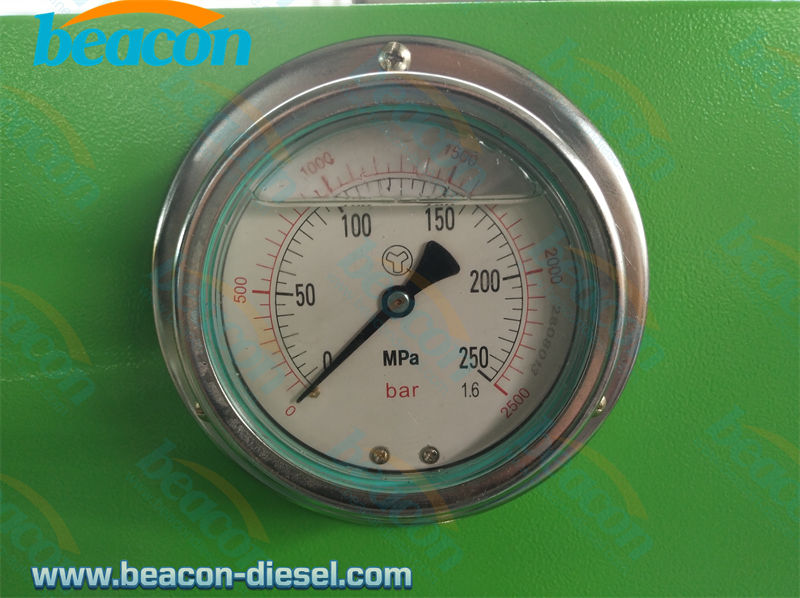 Close-up of the pressure gauge and glass observation cylinder on the PQ1000